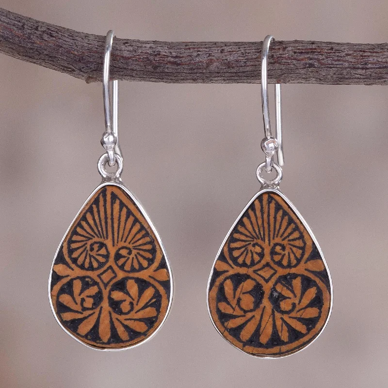 Shop Stylish Jewelry Now And Save Big Infinite Cosmos Sterling Silver and Pumpkin Shell Dangle Earrings from Peru